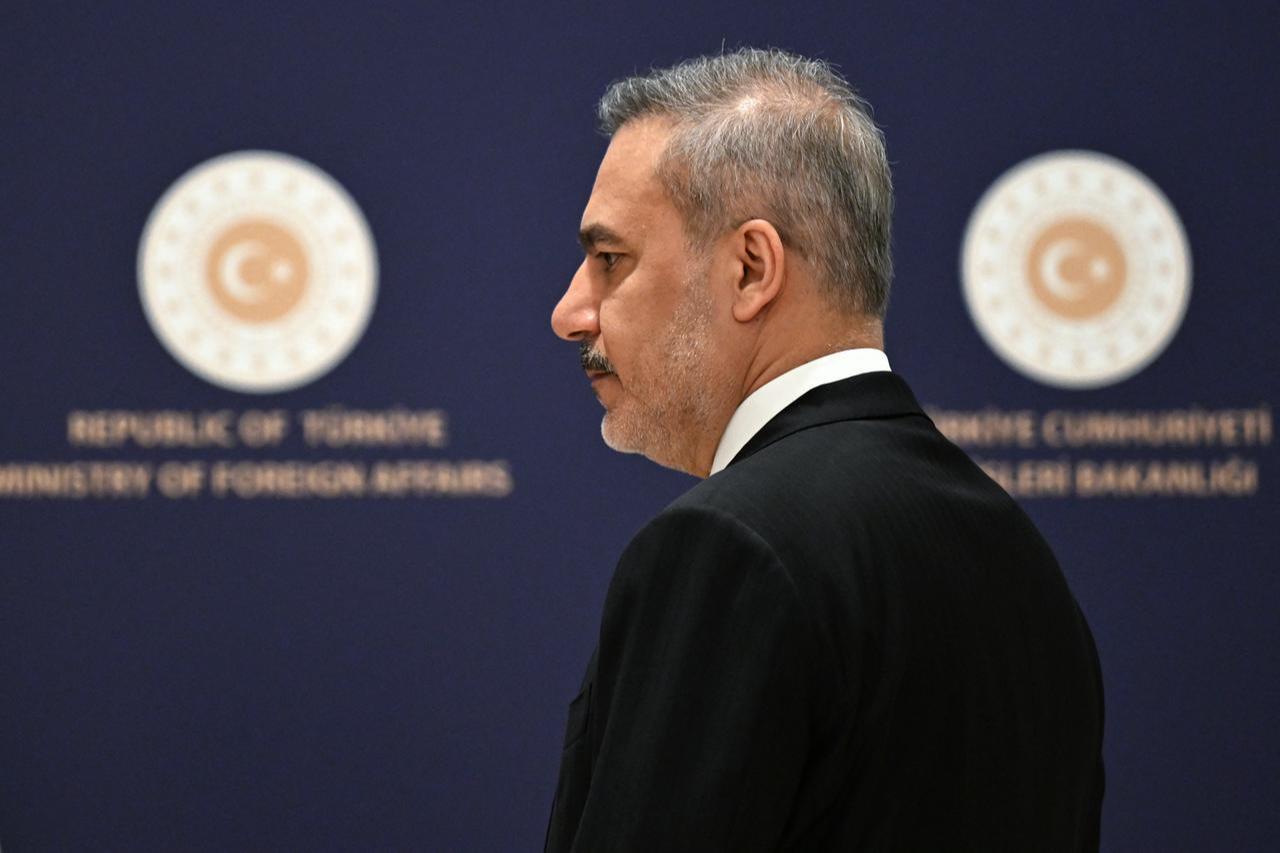 Turkish Minister of Foreign Affairs Hakan Fidan arrives to address the audience during a press briefing in Istanbul, Türkiye on January 15, 2026. (AFP Photo)