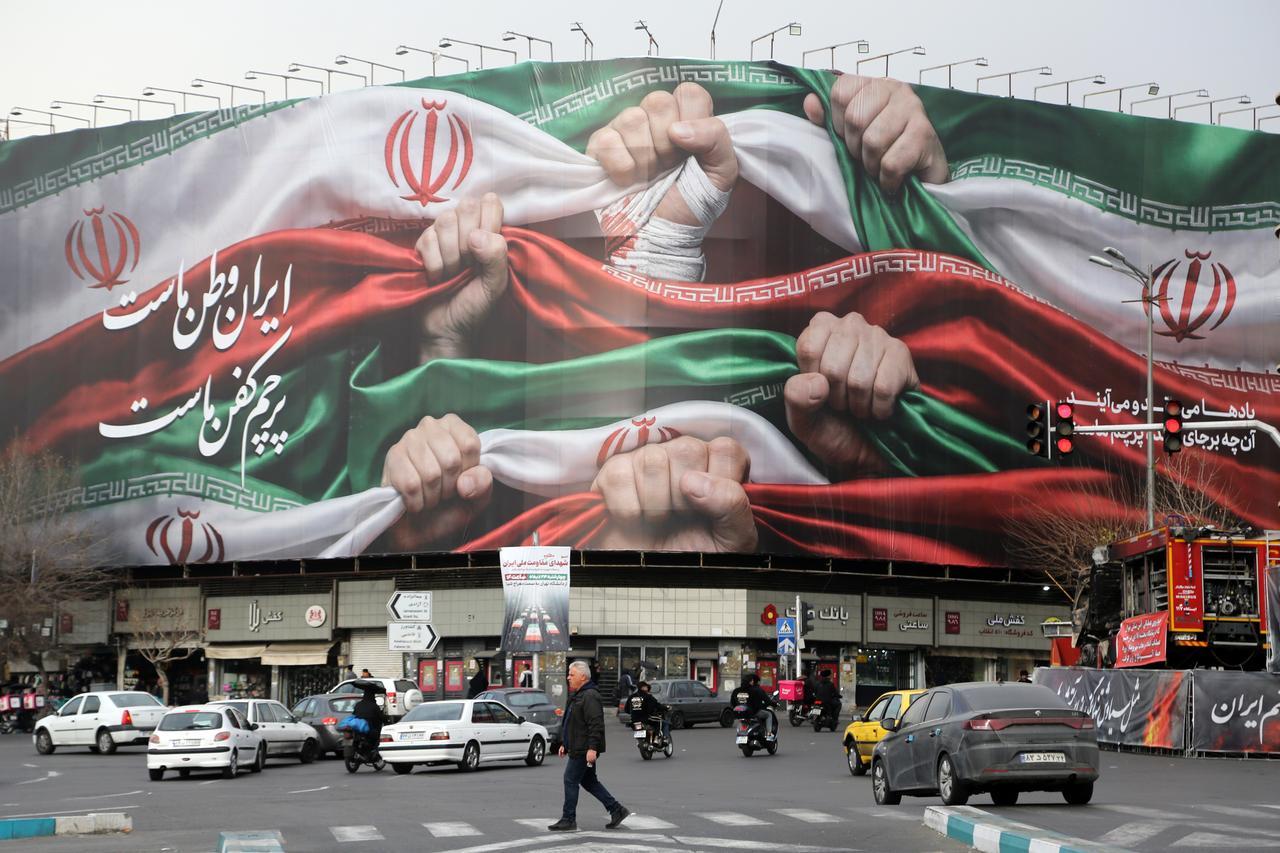 A view of a giant banner, featuring an image of the Iranian flag and the slogan reading "Iran is our homeland, the flag is our shroud," at Enghelab Square in the capital, Tehran, Iran, on January 15, 2026. ( AA Photo )