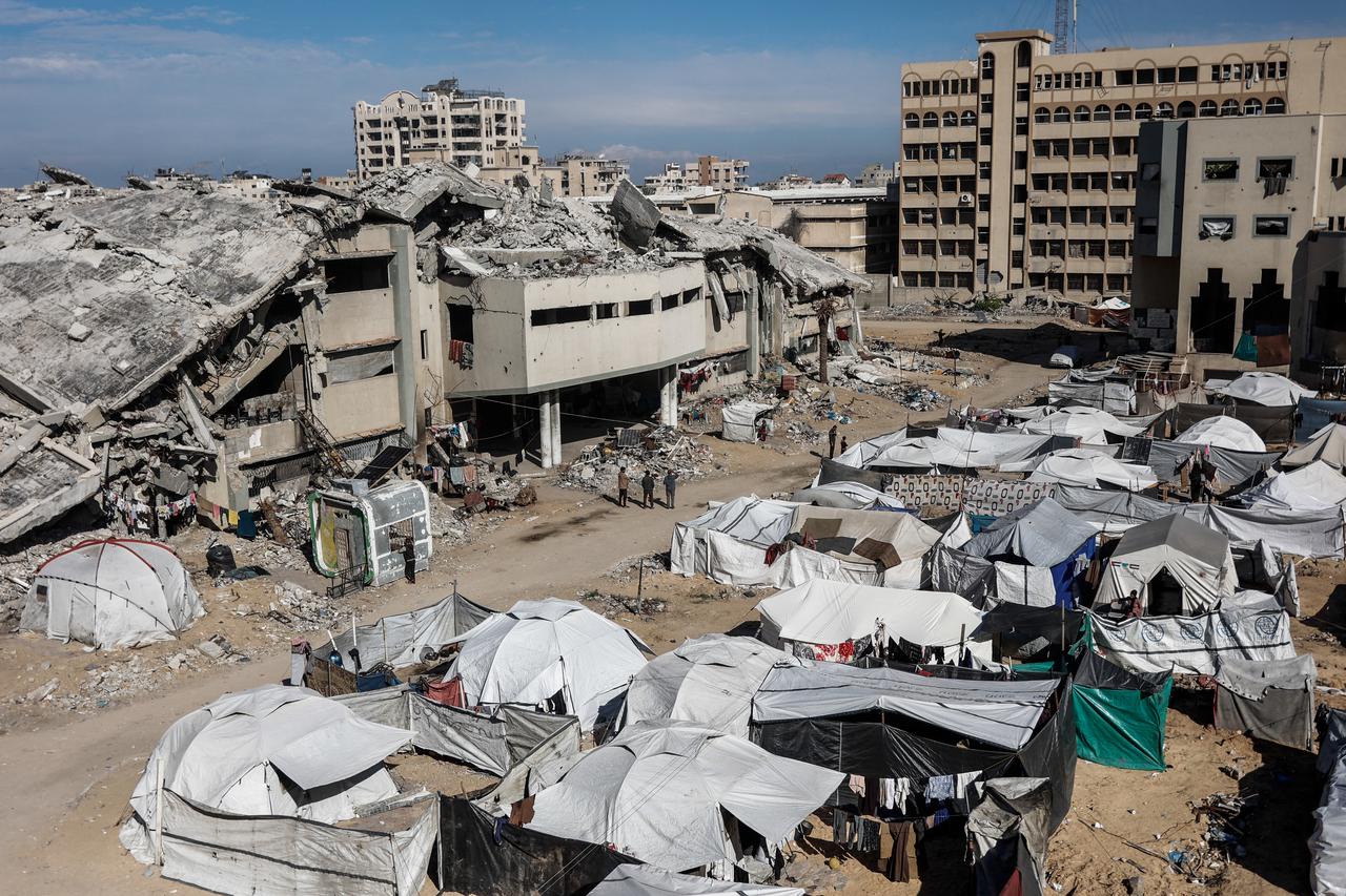 A general view of a camp for displaced Palestinians at the Islamic University following the resumption of classes during a ceasefire between Israel and Hamas in Gaza City, on December 2, 2025. ( AFP Photo)
