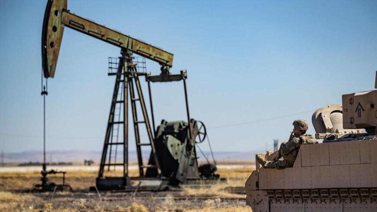 A US soldier sits on a Bradley IFV as troops patrol an oil field near Syria's northeastern border with Türkiye in the al-Qahtaniyah countryside in the far northeast corner of al-Hasakah, Syria, Sept. 3, 2024. (AFP Photo)