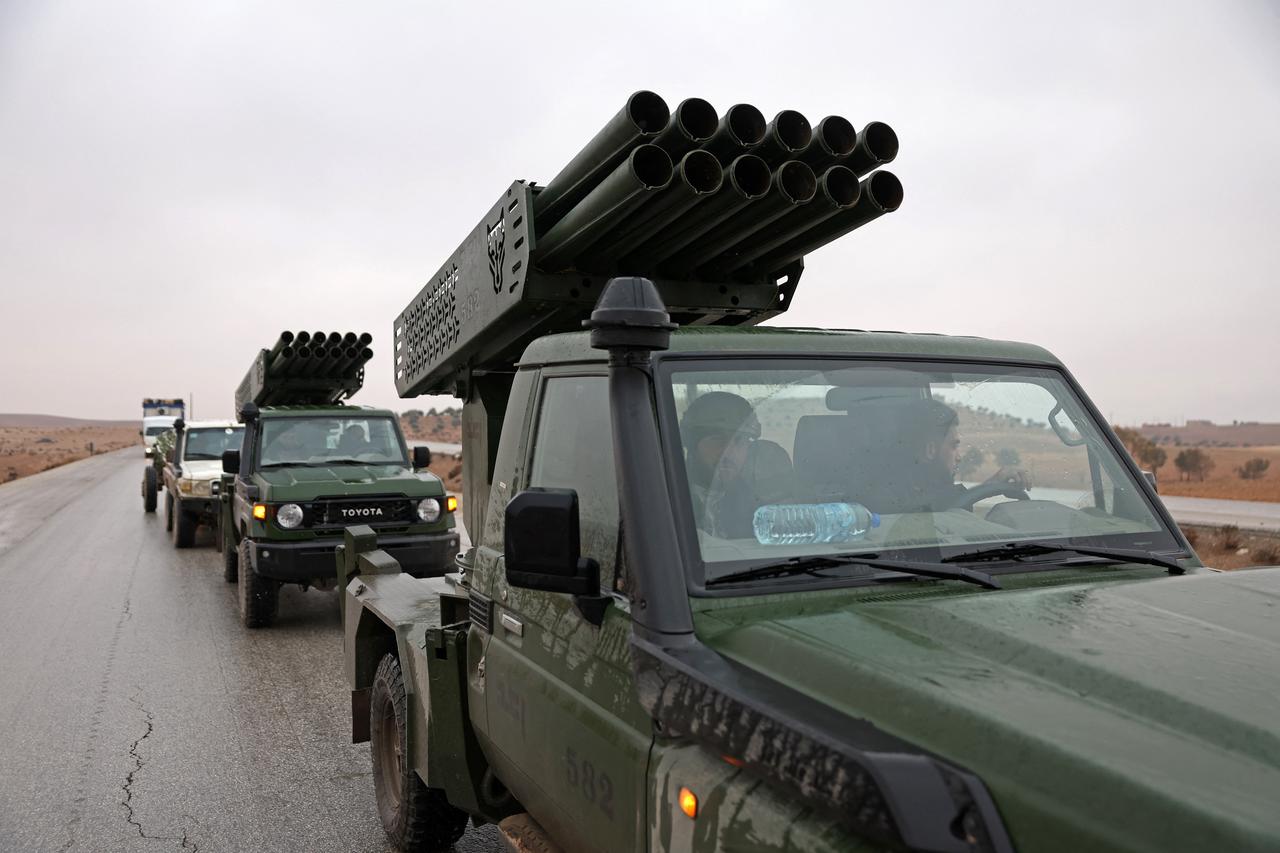 Syrian army personnel patrol in their vehicles mounted with rocket launchers near Tabqa, in Raqqa province, Syria, on January 18, 2026. (AFP Photo)