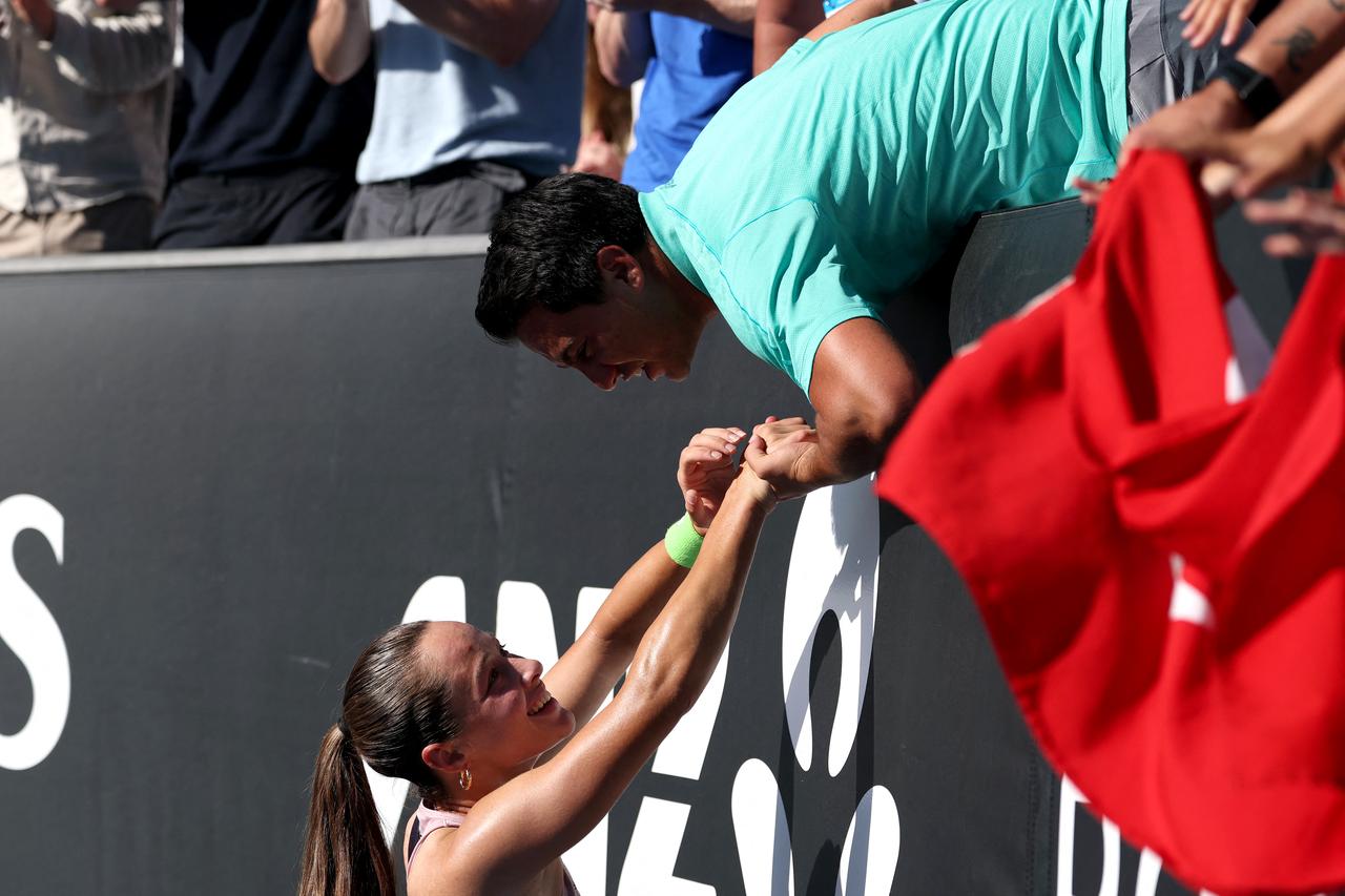 Türkiye's Zeynep Sönmez celebrates with teammates after defeating Russia’s Ekaterina Alexandrova in their women’s singles match on day one of the Australian Open in Melbourne on Jan. 18, 2026. (AFP Photo)