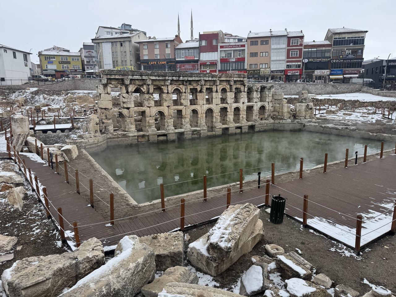 The main facade and large open-air thermal pool of the Basilica Therma Roman Bath are seen as steam drifts over the water on a cold winter day in Sarikaya, Yozgat province, central Türkiye. (AA Photo)