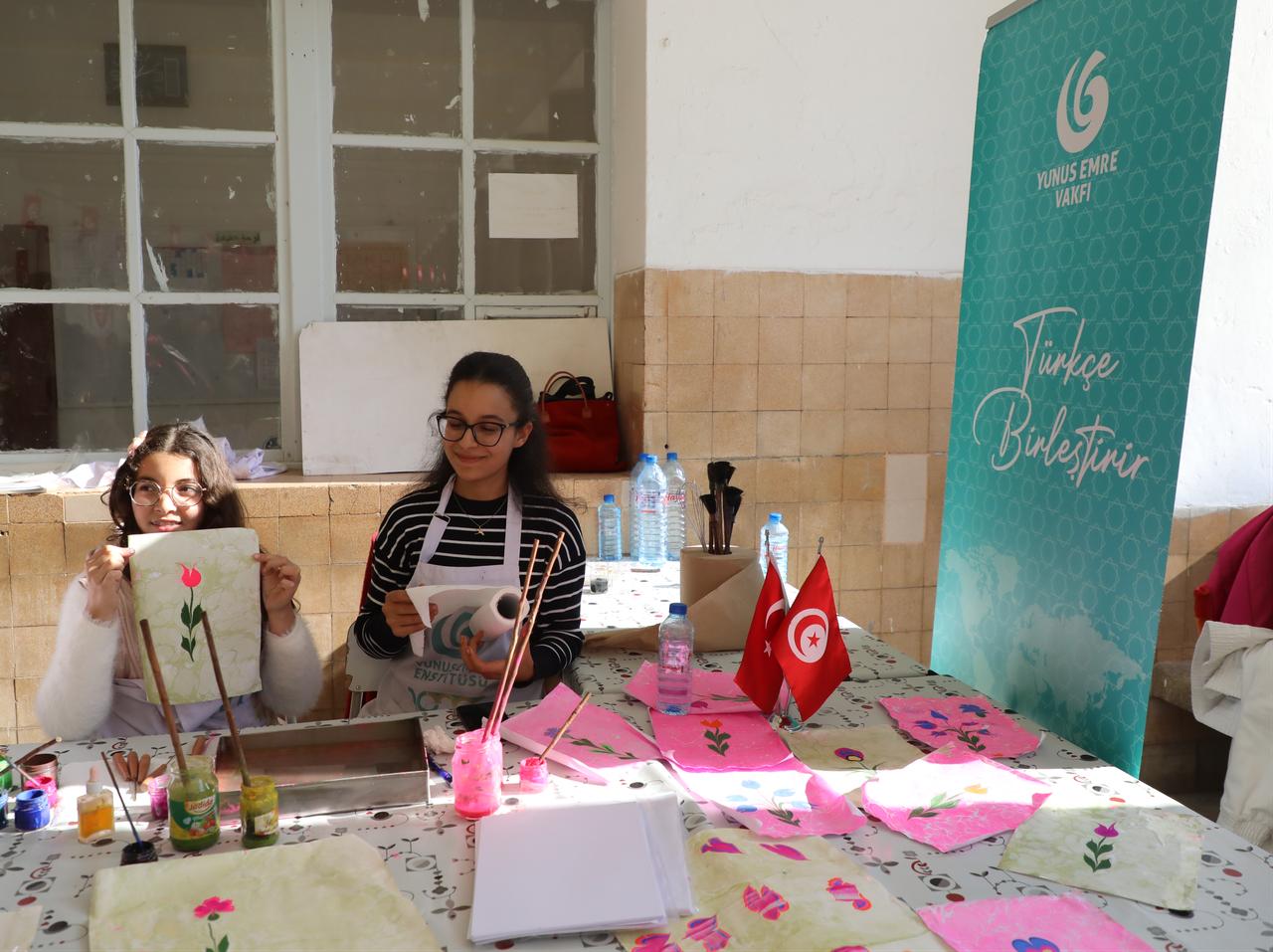 Students take part in a traditional Turkish marbling art (ebru) workshop during the Turkish Culture Day event at Tahir Sefer High School in Sousse, Tunisia, Jan. 18, 2026. (AA Photo)