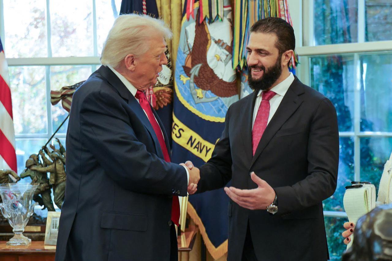 President Donald Trump (L) shaking hands with Syrias President Ahmed al-Sharaa at the White House in Washington DC. Syrias President Ahmed al-Sharaa met US President Donald Trump at the White House on Nov. 10, 2025. (AFP Photo / SANA)
