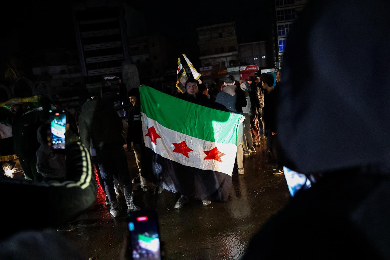 Residents gather in the streets of Raqqa city to celebrate after the region was liberated from the YPG, operating under the name SDF, January 18, 2026. (AA Photo)