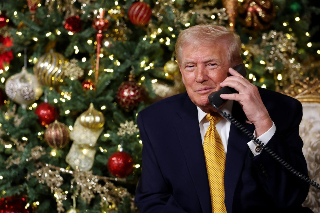 US President Donald Trump calls children as he participates in tracking Santa Claus movements with the North American Aerospace Defense Command (NORAD) Santa Tracker on Christmas Eve in Palm Beach, Florida on Dec. 24, 2025. (AFP Photo)