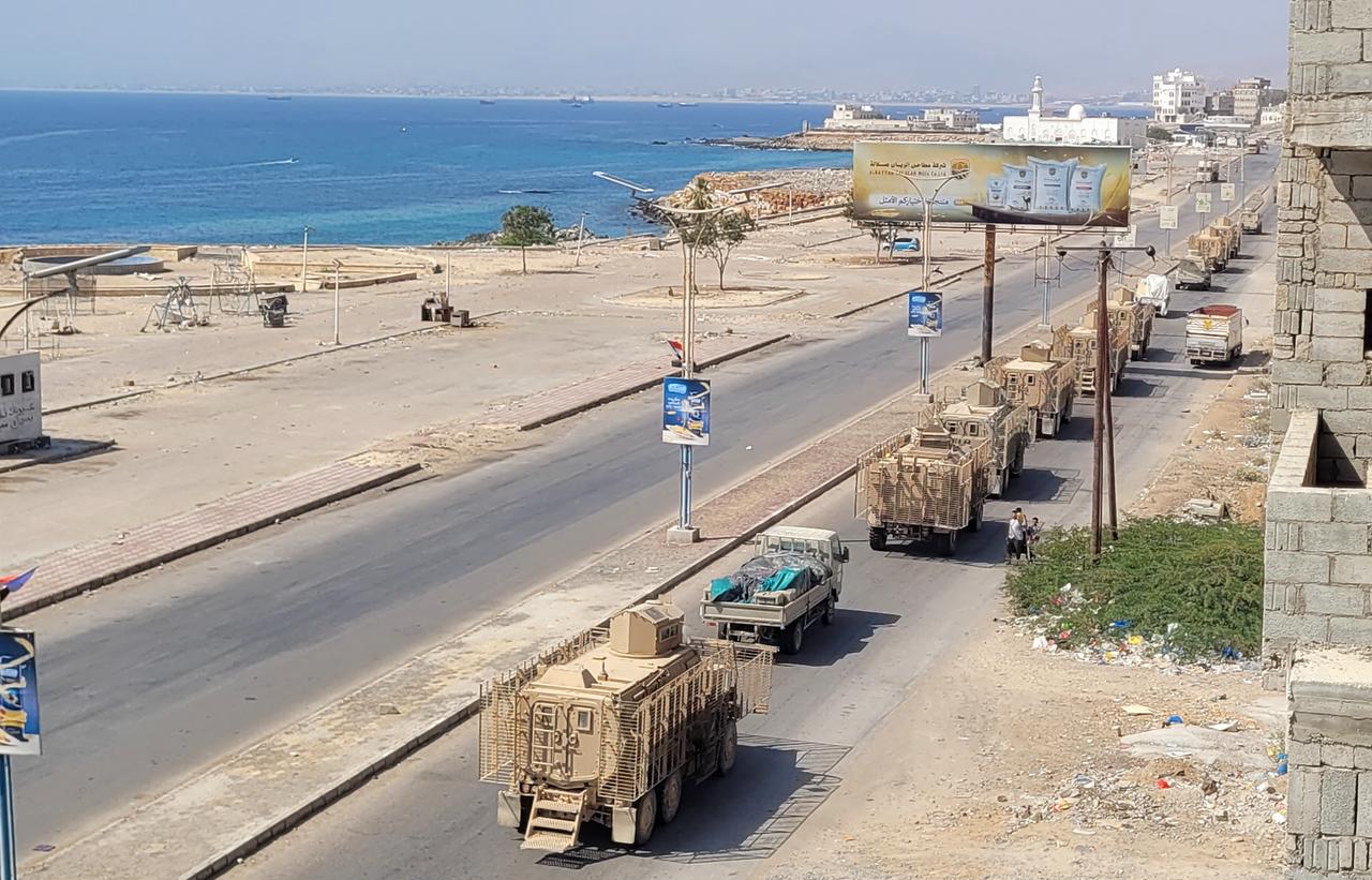 A convoy of armoured vehicles makes its way along a street in the port city Mukalla, southern Yemen, on January 1, 2026. (AFP Photo)