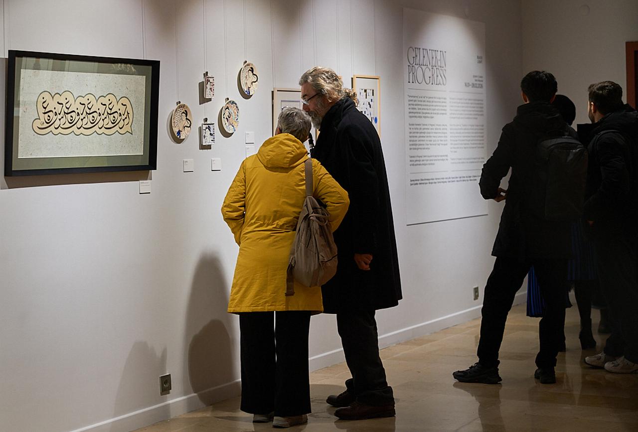 A visitor views artworks displayed as part of the exhibition “Gelenek: In Progress” at Black Light Gallery in the Karakoy district of Istanbul, Türkiye, on Jan. 19, 2026. (AA Photo)