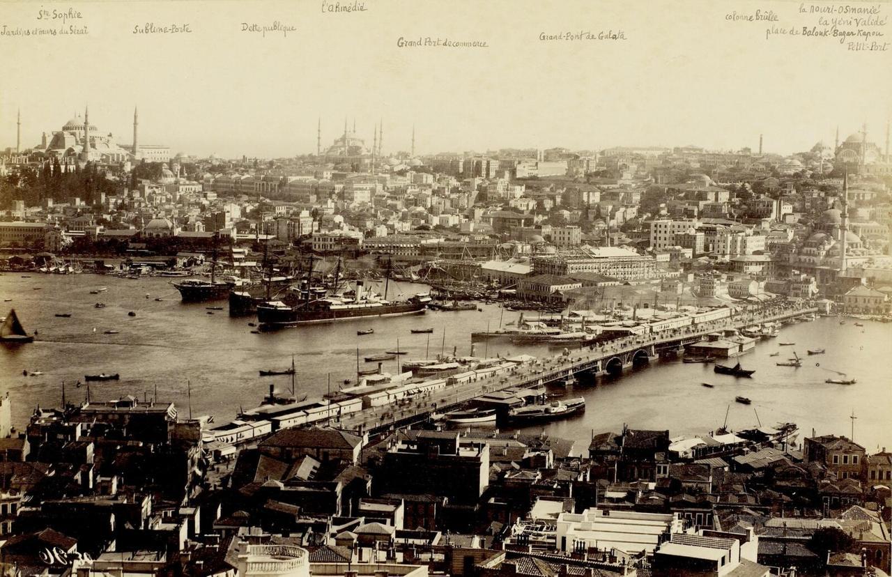 A panoramic view from Galata Tower showing the bustling Galata Bridge, the Golden Horn, and the skyline filled with Ottoman period mosques and buildings, Istanbul, Türkiye, 19th century. (Photo via Eski Istanbul)