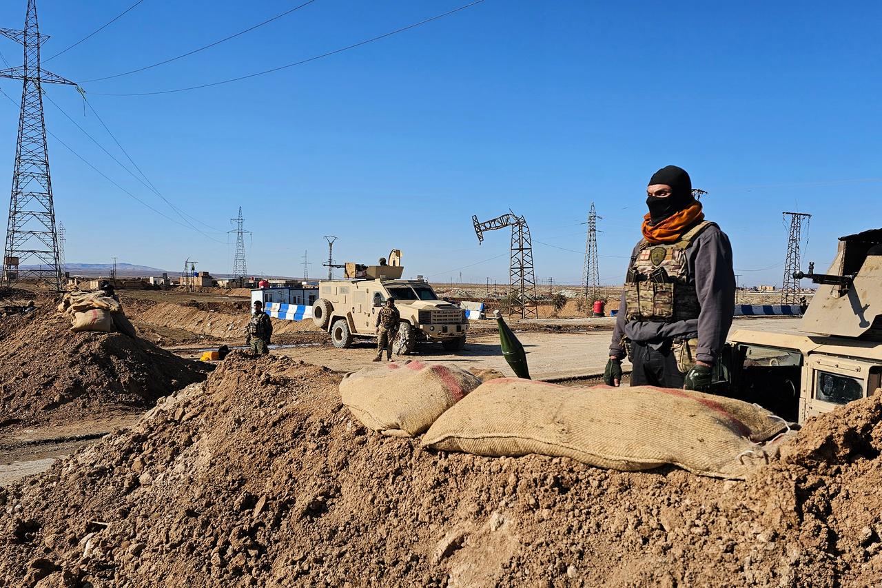Terrorist organization YPG/SDF member stand watch in the city of Hasakah, in northeastern Syria, on January 20, 2026. (AFP Photo)