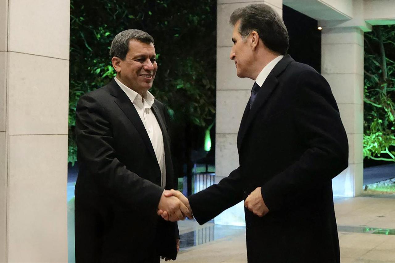 KRG President Nechirvan Barzani (R) shaking hands with the SDF's Mazloum Abdi in Erbil, on January 17, 2026. (Photo by Handout/Iraqi Kurdistan Presidency/AFP)