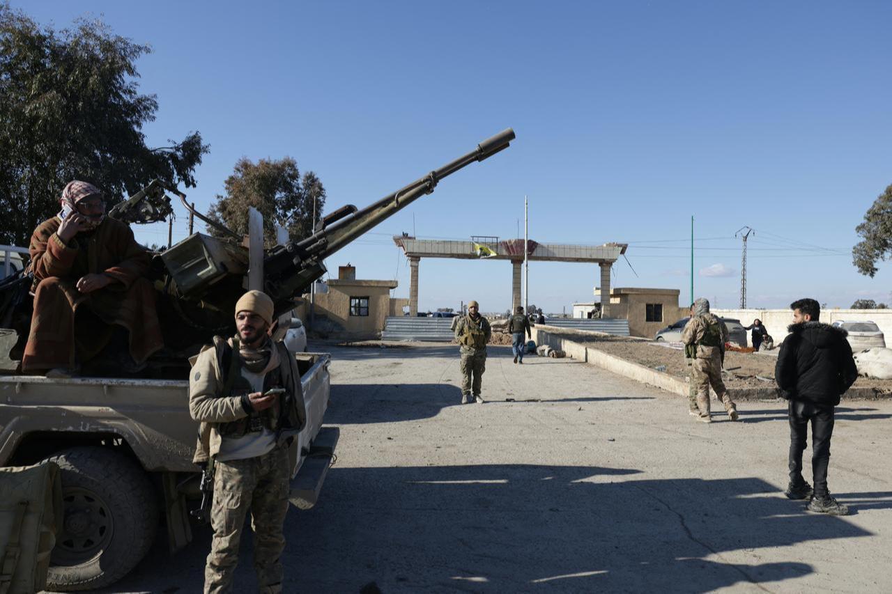 Syrian government forces take psession of an SDF military base as they enter the city of Raqqa, Syria on January 19, 2026. (AFP Photo)