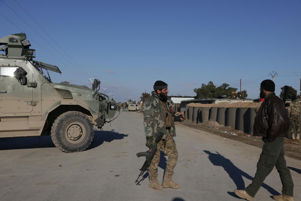 Syrian government forces take possession of the SDF military base as they enter the city of Raqqa, Syria on January 19, 2026. (AFP Photo)