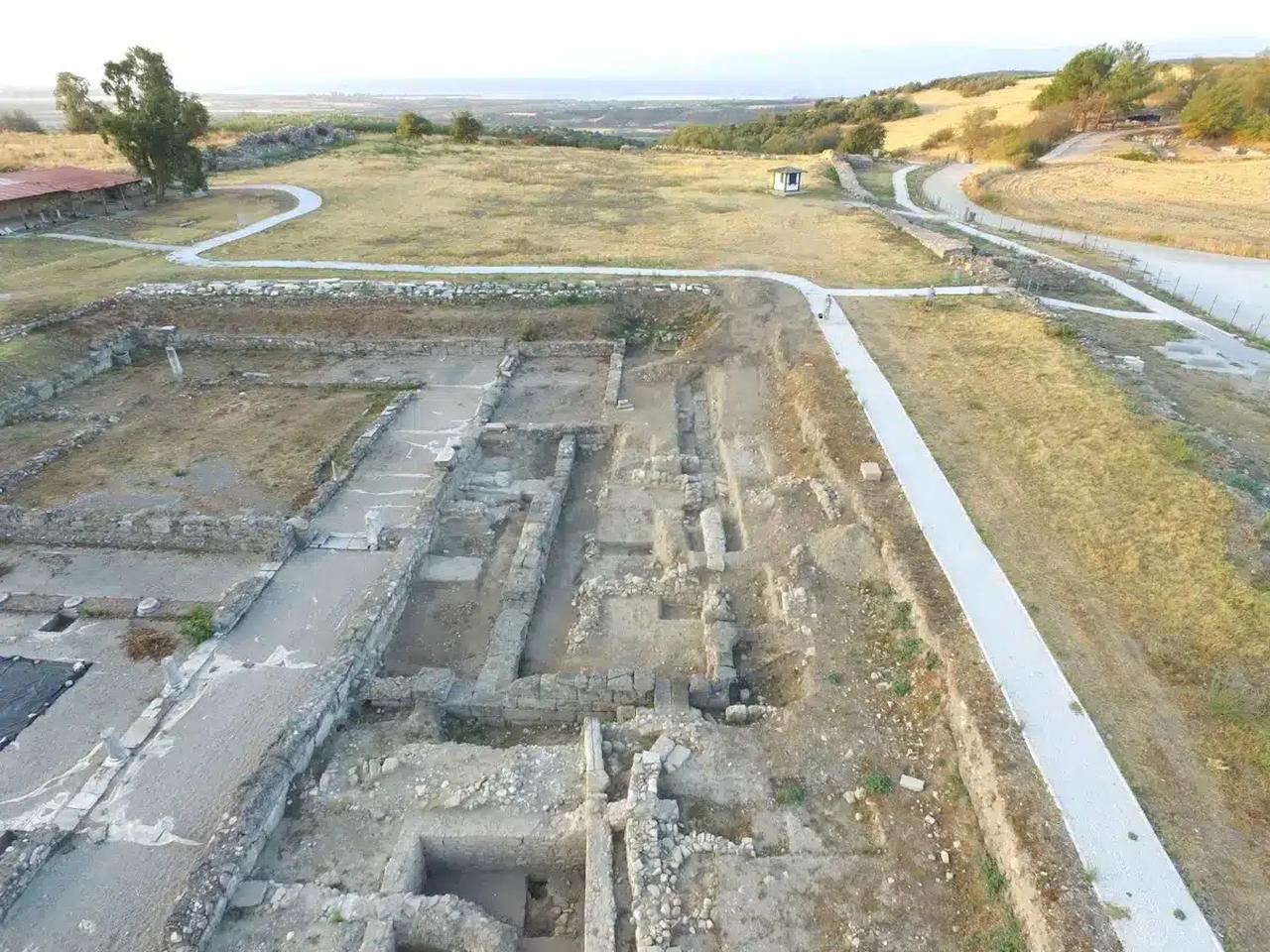 Aerial view of the excavation area at the Amphipolis Acropolis, where archaeologists identified remains of a 4th-century BC structure interpreted as a cult building.  (Photo via AMNA)