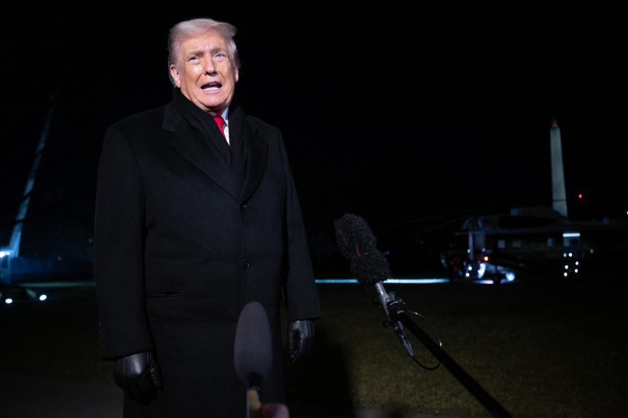US President Donald Trump talks to the press as he walks to board Marine One at the White House in Washington, DC, on January 20, 2026. (AFP Photo)
