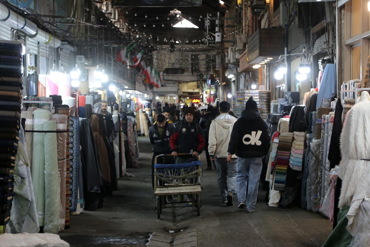 People shop at Grand Bazaar as life continues as normal amid deepening economic crisis, in Tehran, Iran, on Jan. 19, 2026. (AA Photo)