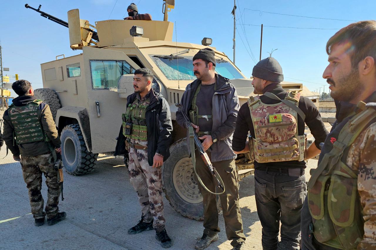Terrorist organization YPG/SDF members gather in Hasakah, in northeastern Syria, on January 20, 2026. (AFP Photo)