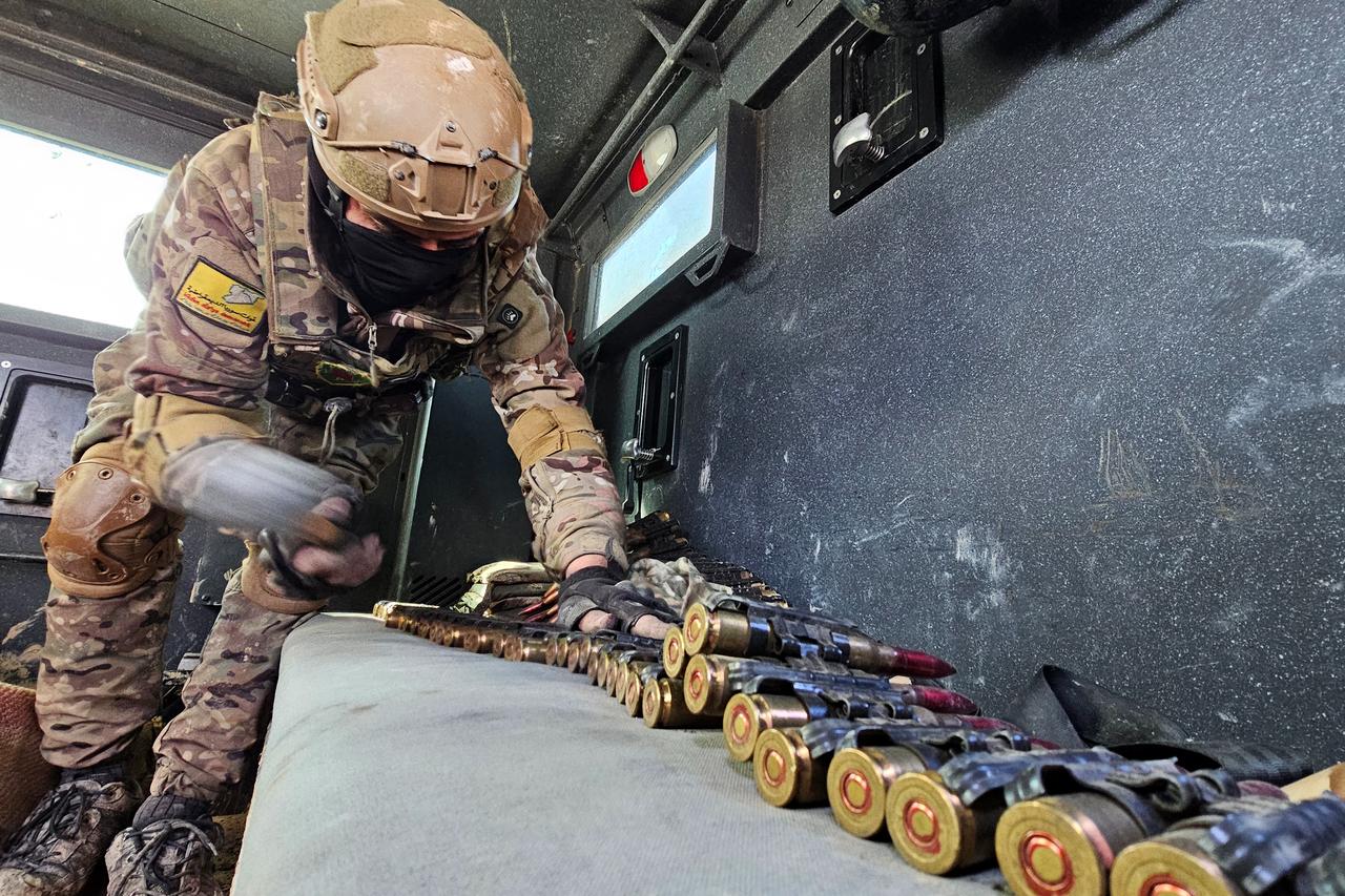 A terrorist organization YPG/SDF member arranges munitions in the city of Hasakah, in northeastern Syria, on January 20, 2026. (AFP Photo)