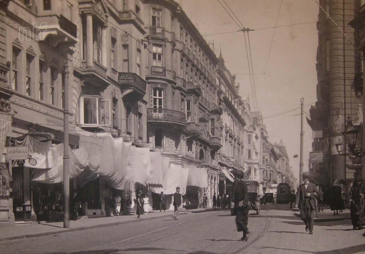 People walk along Istiklal Avenue as trams pass through the avenue, Istanbul, Türkiye, 1920s. (Courtesy of Old Istanbul Photo Archive)