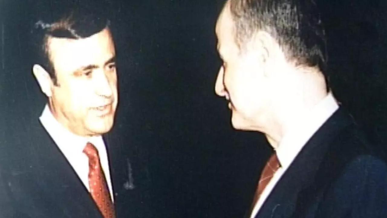 Former Syrian President Hafez al-Assad, with his youngest brother, Rifaat, attending a reception in London in 1986 (AFP Photo)