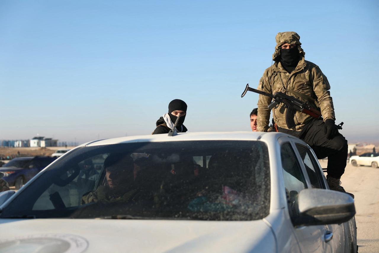 Members of Syrian security forces in their vehicle enter the Al-Hol camp in the desert region of Hasakah province, Syria, January 21, 2026. (AFP Photo)