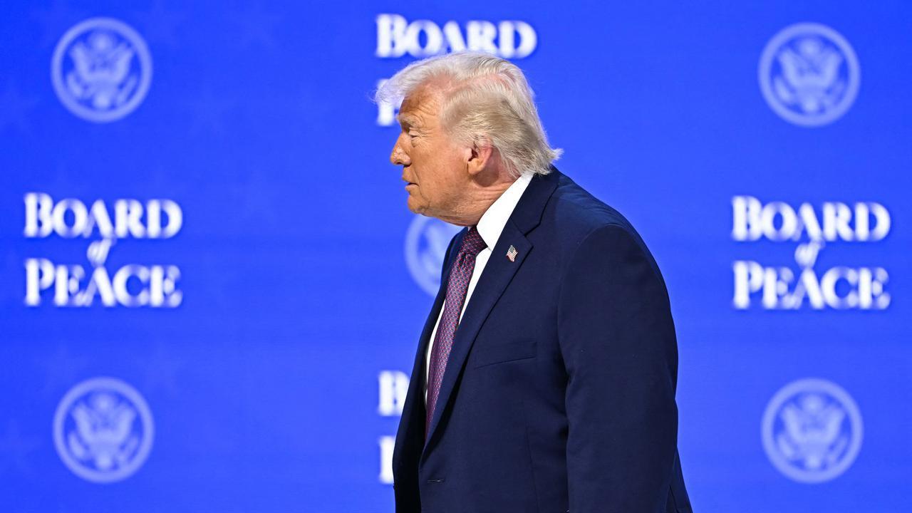 US President Donald Trump walks at the "Board of Peace" meeting during the World Economic Forum (WEF) annual meeting in Davos on January 22, 2026. (AFP Photo)
