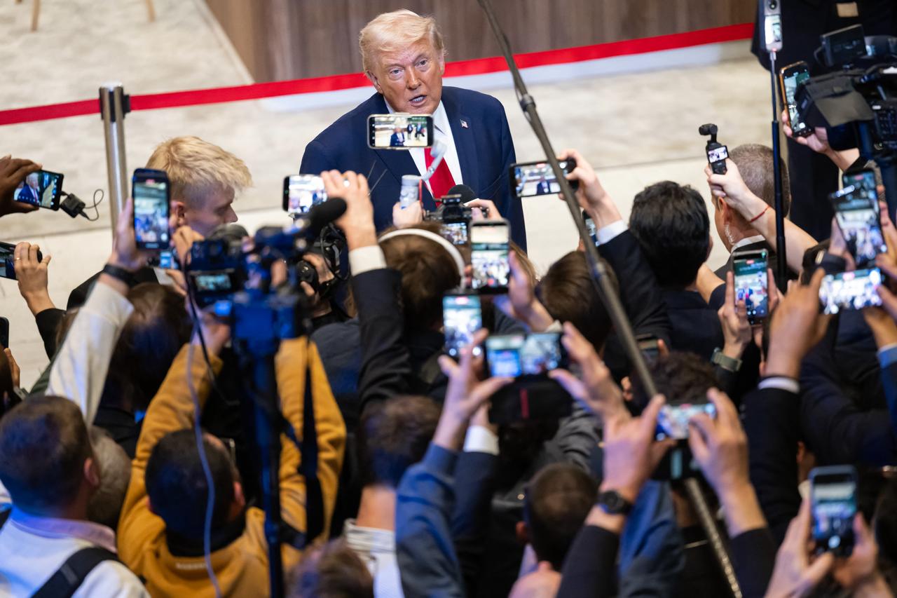 U.S. President Donald Trump delivers remarks to journalists as she leaves a plenary session at the Congress Hall, walking past journalists after his speech on the sidelines of the 56th annual meeting of the World Economic Forum (WEF) in Davos on Jan. 21, 2026. (AFP Photo)