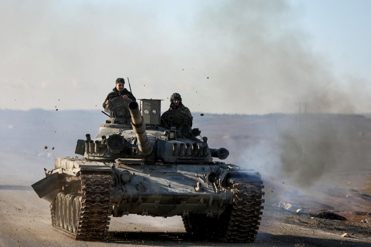 Syrian government forces make their way to the city of Hasakah in northeastern Syria on January 20, 2026.(AFP Photo)