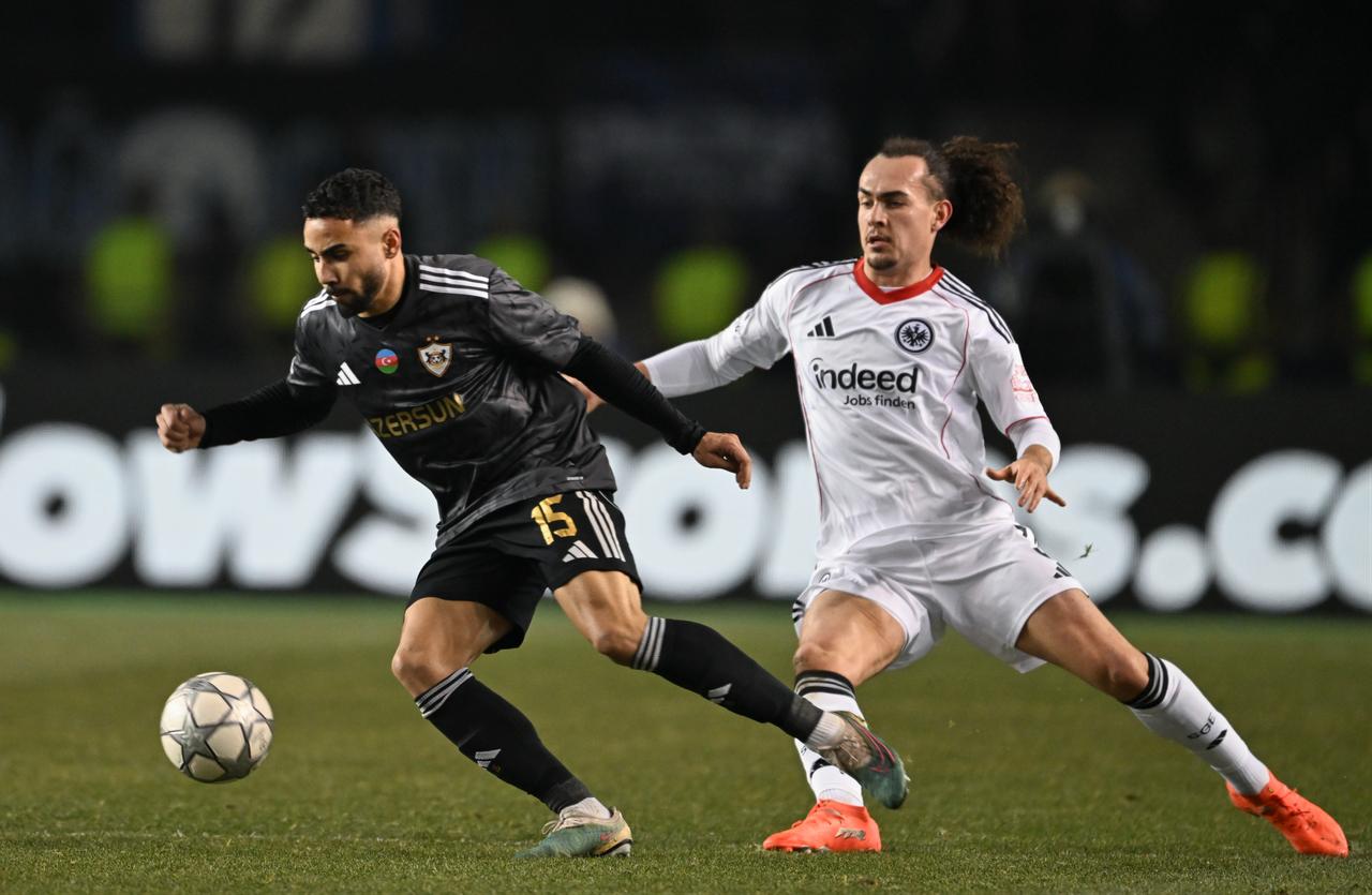 Leandro Andrade (L) of Qarabaq FK in action against Arthur Theate (R) of SG Eintracht Frankfurt during the UEFA Champions League soccer match between Qarabaq FK and SG Eintracht Frankfurt, in Baku, Azerbaijan, Jan. 21, 2026. (IHA Photo)