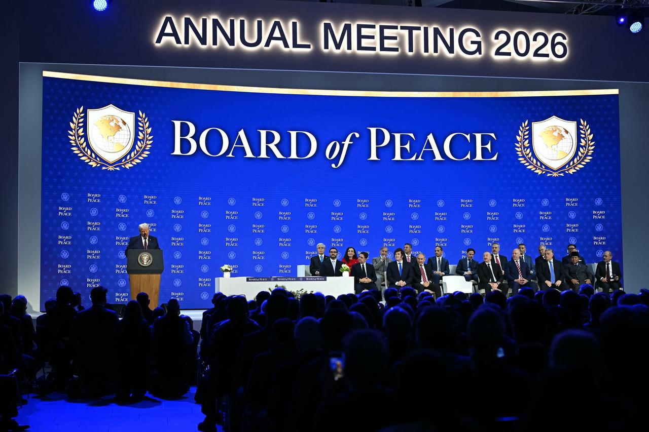 US President Donald Trump (L) speaks at the "Board of Peace" meeting during the World Economic Forum (WEF) annual meeting in Davos on January 22, 2026. (AFP Photo)