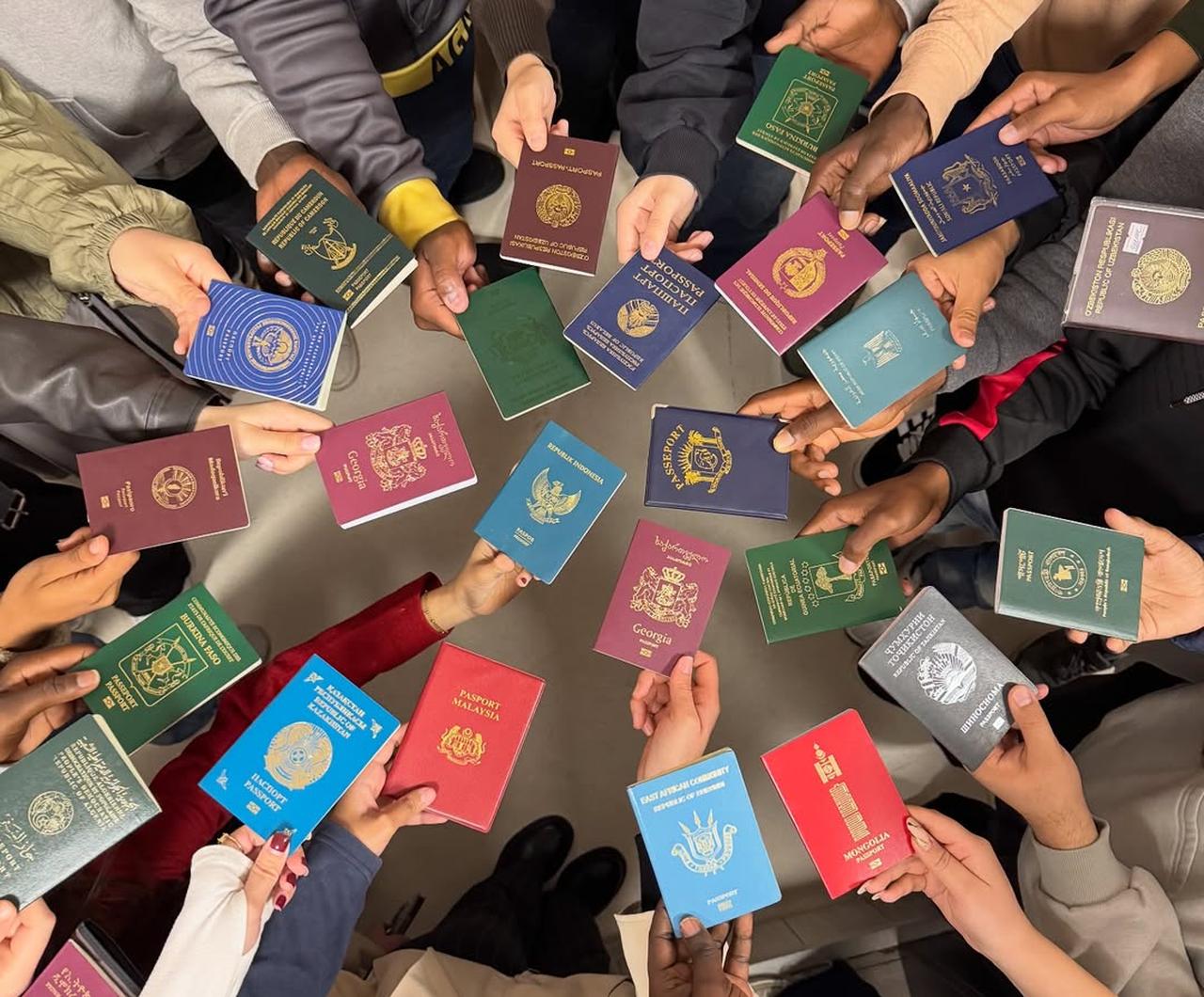 Students from around the world pose with their passports at Abant Izzet Baysal University, Bolu, Türkiye, Nov. 15, 2025. (Photo via Instagram/@baibutomer)