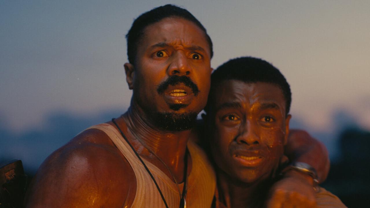 Two characters react with fear and urgency during a dramatic moment in the film Sinners, accessed on June 1, 2025. (Photo via imdb.com)