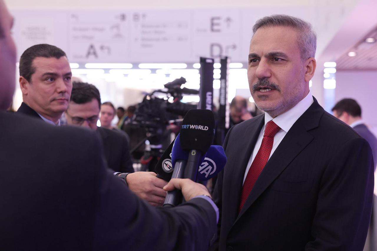 Foreign Minister Hakan Fidan speaks to press after the signing ceremony of the Peace Charter for Gaza as part of the 56th World Economic Forum in Davos, Switzerland on Jan. 22, 2026. ( Turkish Foreign Ministry - Anadolu Agency )