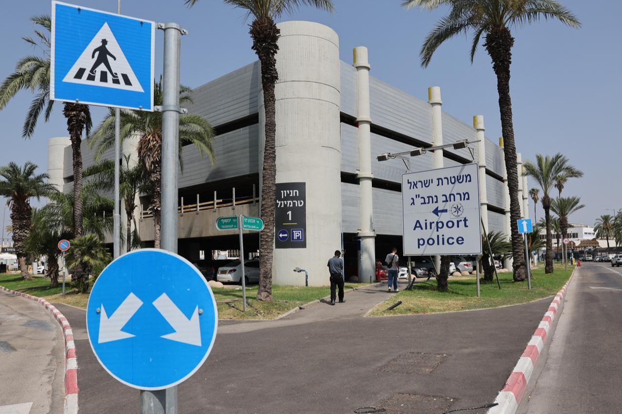 People walk past a sign directing to the police station at Ben Gurion Airport near Tel Aviv on June 10, 2025. (AFP Photo)