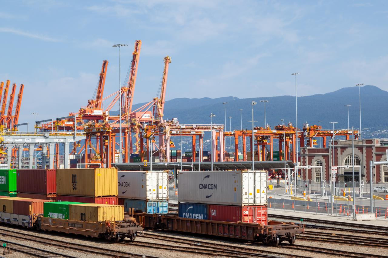 Shipping containers and freight trains are seen at the Port of Vancouver in British Columbia, Canada, July 8, 2023. (Adobe Stock Photo)
