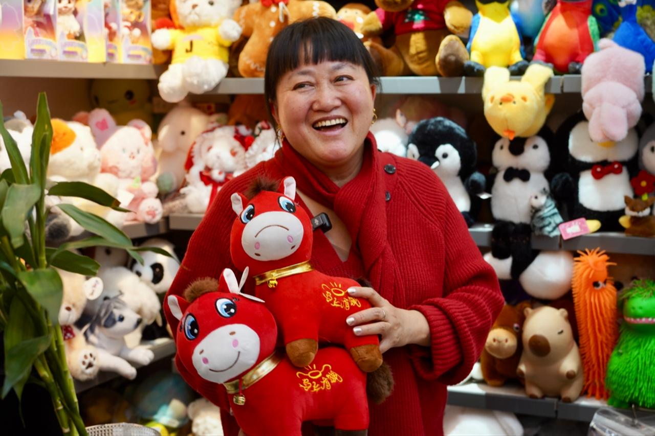 A red horse doll that has gone viral on Chinese social media after a manufacturing error gave it an unusually sad expression ( Photo via X / @investing_china )