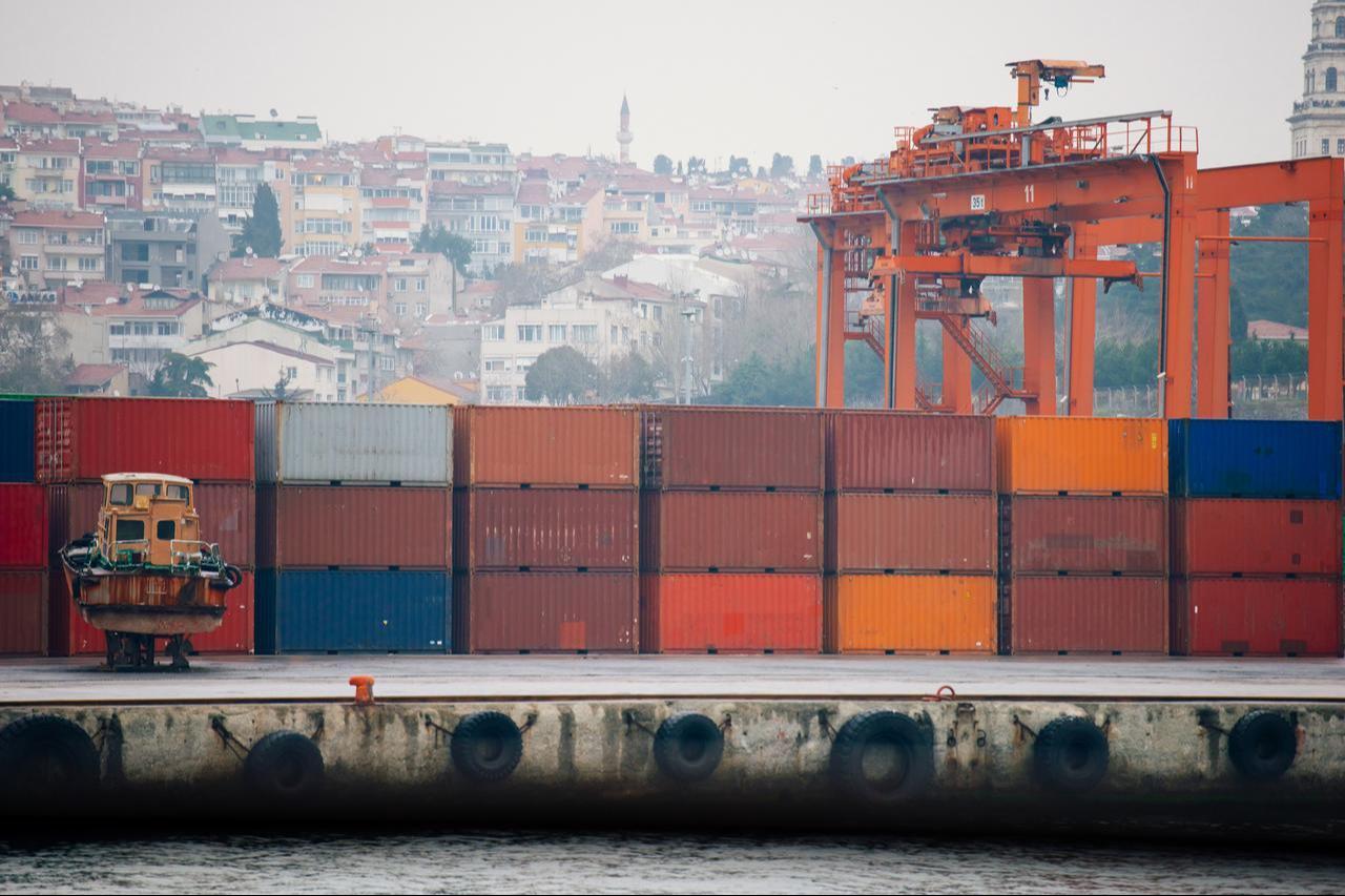 A view of stacked shipping containers and cranes at a freight terminal in Istanbul, Türkiye. (Adobe Stock Photo)