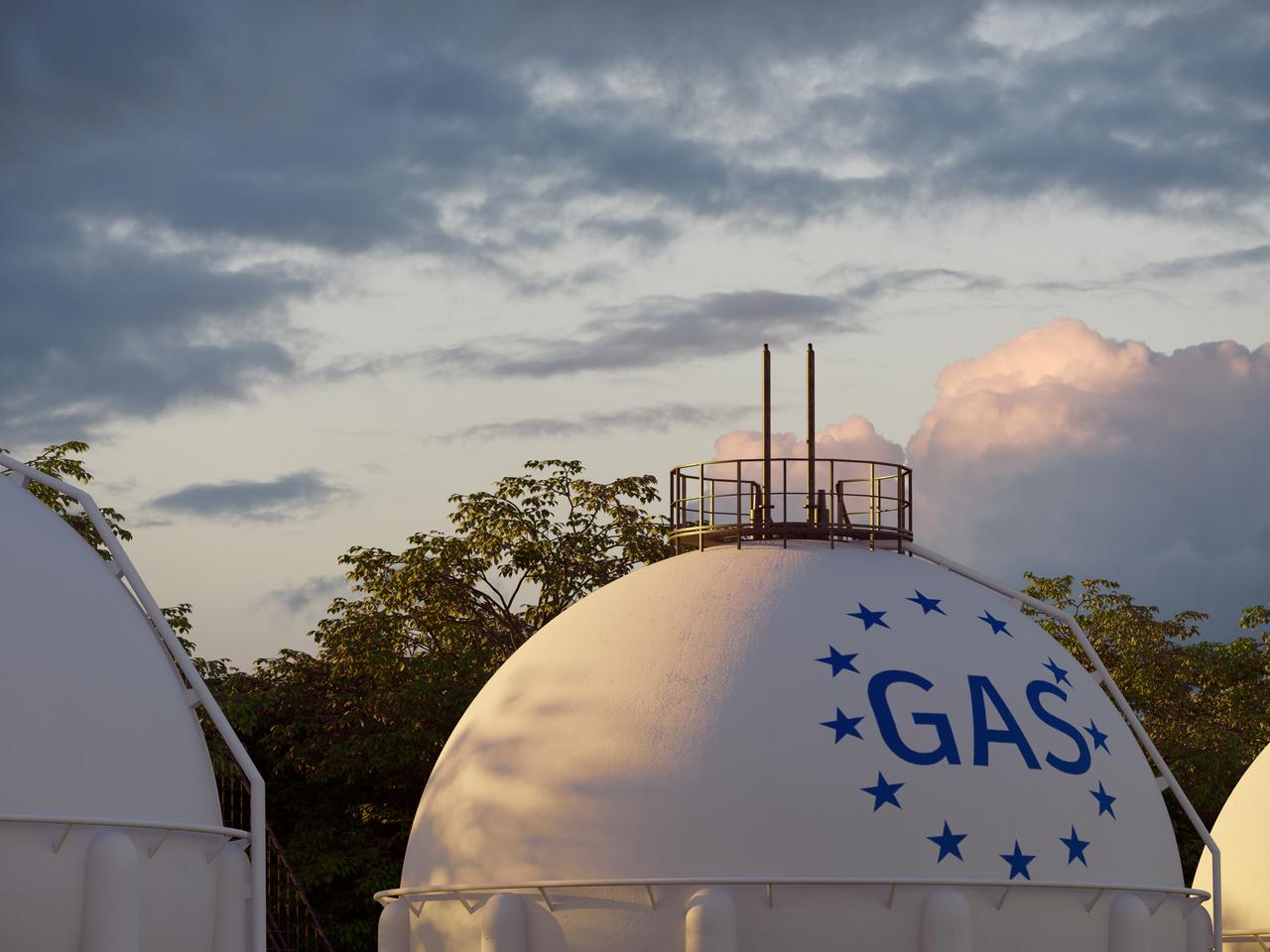 A view of spherical gas storage tanks marked with EU stars. (Adobe Stock photo)