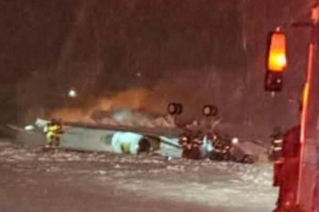 Private jet carrying 8 crashes at airport in northeastern US state