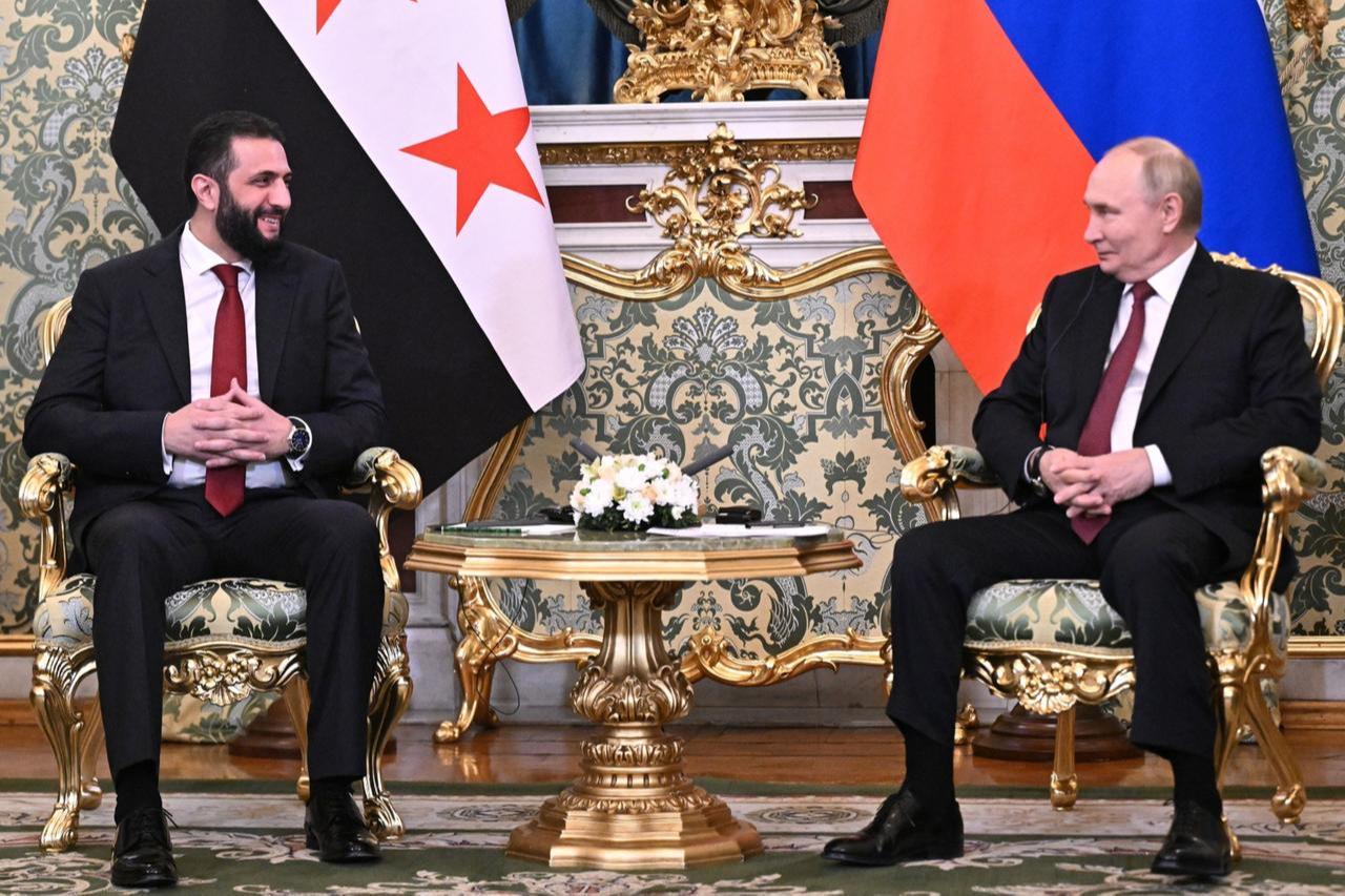 Syrian President Ahmed al-Sharaa (L) meets with Russian President Vladimir Putin (R) in Moscow, Russia, Oct. 15, 2025. (Photo via Kremlin Press Service)