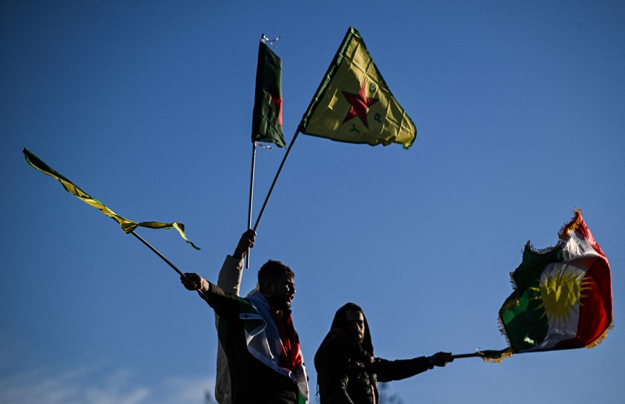 Protesters wave terrorist organization YPG/SDF flags as they take part in a demonstration in central Paris, on January 24, 2026. (AFP Photo)