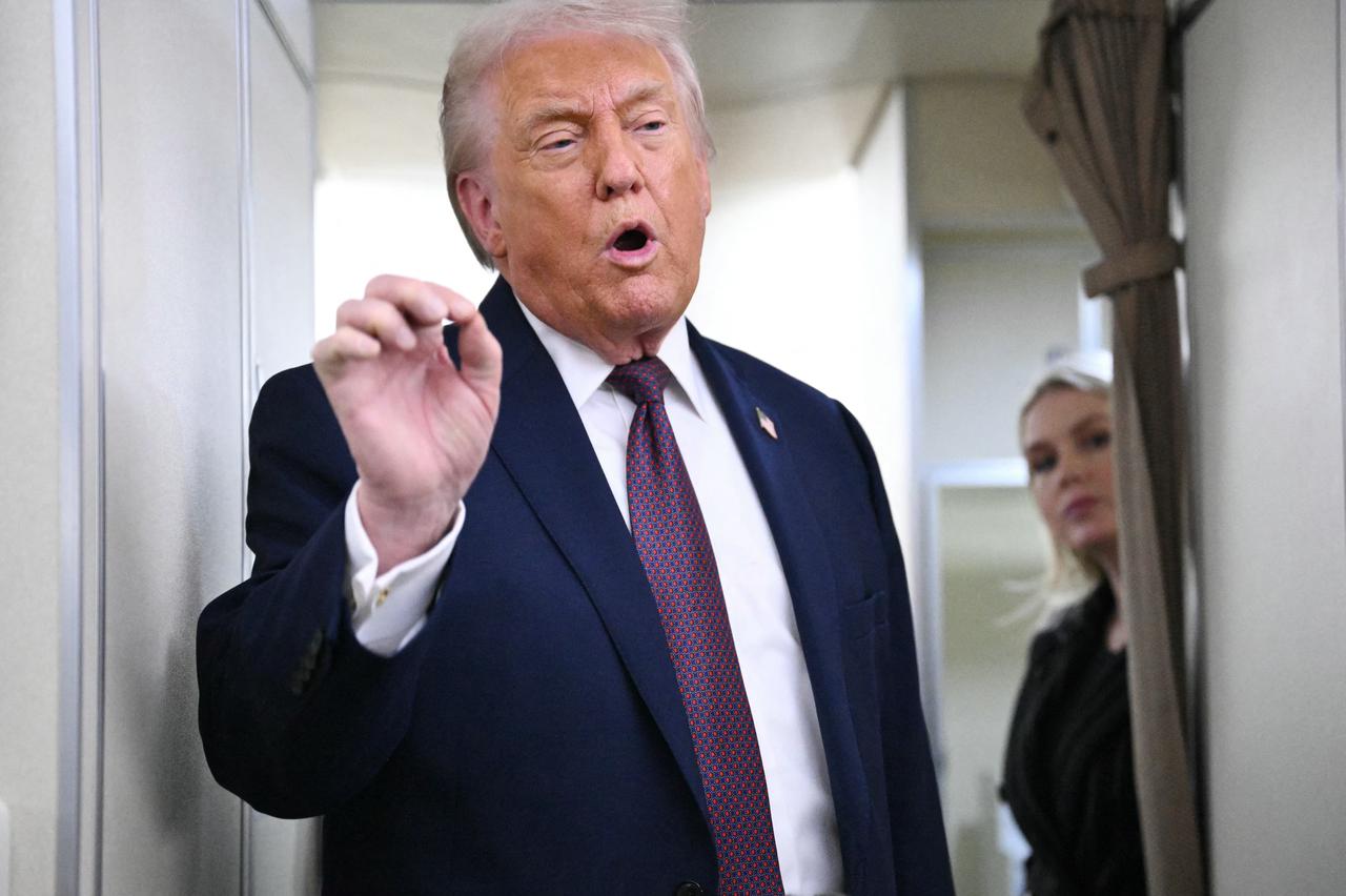 US President Donald Trump speaks to reporters while in flight on Air Force One, traveling from Shannon, Ireland, en route to Joint Base Andrews in Maryland, Jan. 22, 2026. (AFP Photo)