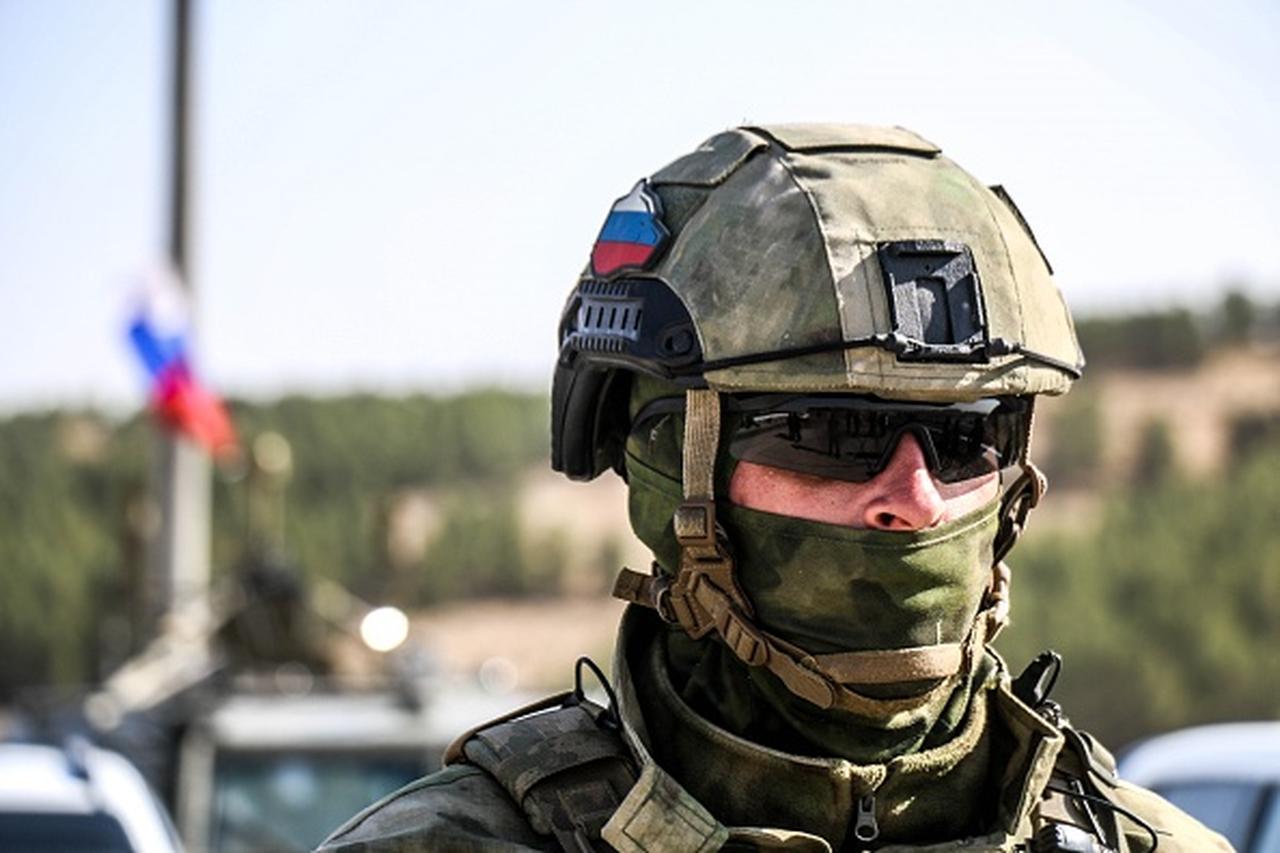 A Russian soldier is seen near an armoured vehicle as he and other soldiers enter the base at the Tishrin Dam on the Euphrates, Syria, on November 18, 2019. (AA Photo)