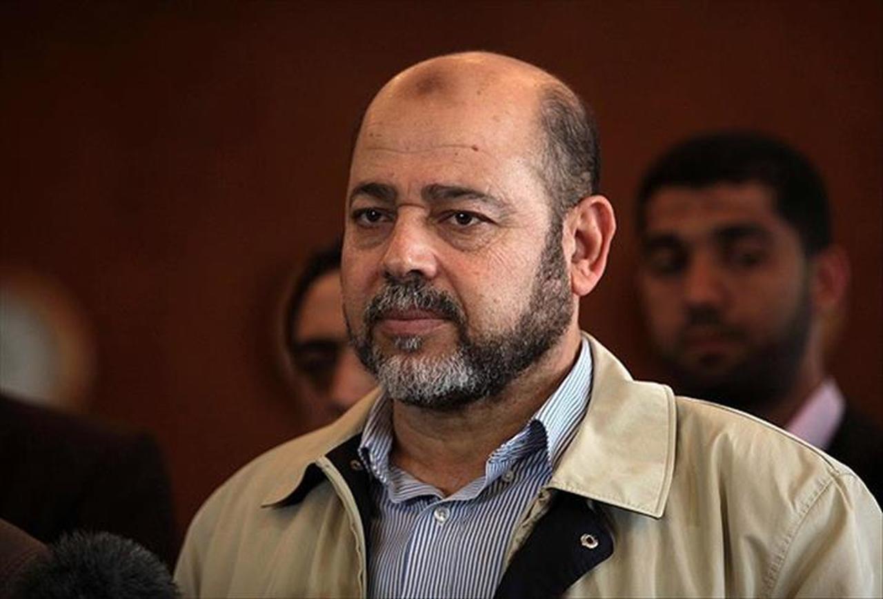 Palestinian Fatah movement leader Azzam Al-Ahmad (not seen) and Mousa Abu Marzook, senior member of Hamas, attend a press conference in Gaza City, Gaza on May 27, 2014. ( AA Photo )