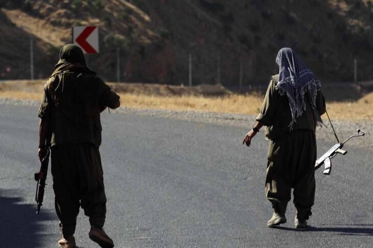 Terrorists of the PKK carries an rifles on a road in the Qandil Mountains, the so-called PKK headquarters in Iraq, on June 22, 2018. (AFP Photo)