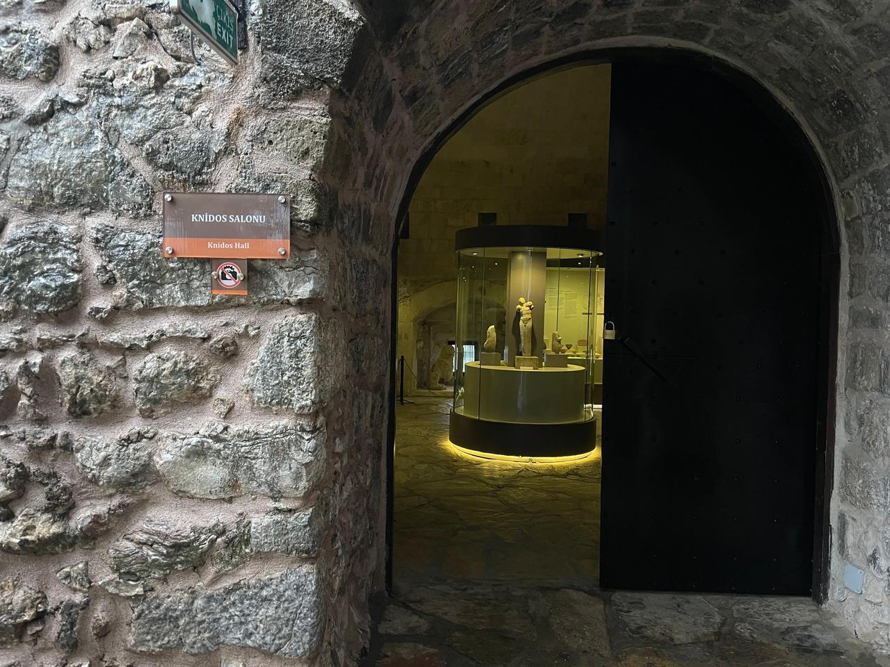 The entrance to the Knidos Hall at Marmaris Museum, seen through a stone archway inside Marmaris Castle, marking one of the museum’s main exhibition sections dedicated to finds from the ancient city of Knidos in Mugla, Türkiye, Jan. 27, 2026. (Photo by Koray Erdogan/Türkiye Today)