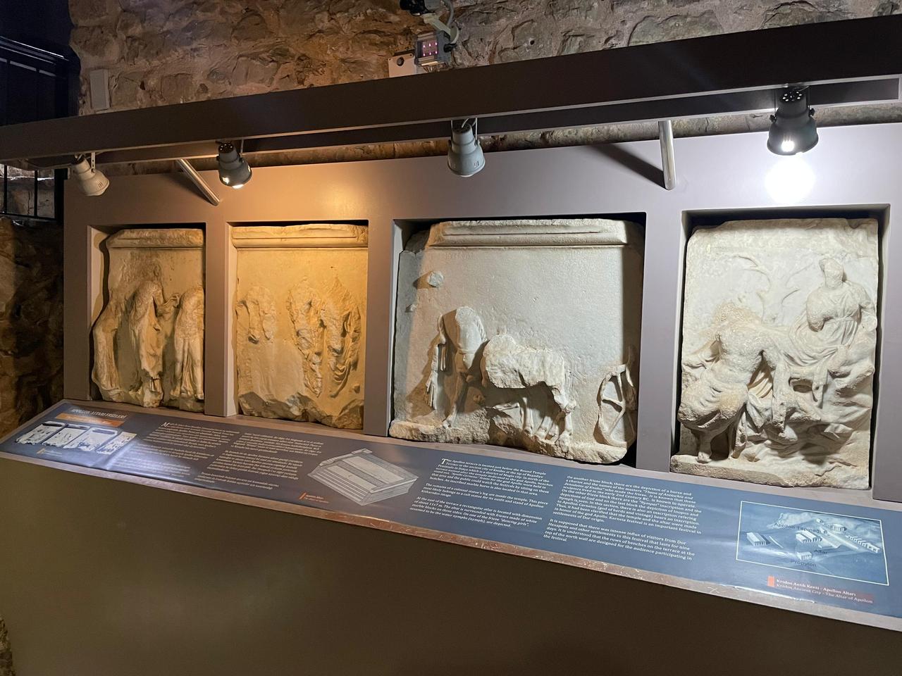 Stone relief panels displayed in Marmaris Museum depict sculptural scenes from antiquity, presented inside the historic stone interior of Marmaris Castle in Mugla, Türkiye, Jan. 27, 2026. (Photo by Koray Erdogan/Türkiye Today)