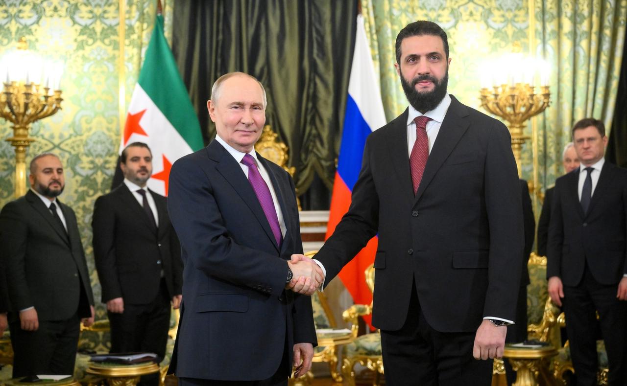 Russian President Vladimir Putin (L) meets with Syrian President Ahmad Al-Sharaa (R) in Moscow, Russia on Jan. 28, 2026. (Kremlin Press Office Handout / AA Photo)
