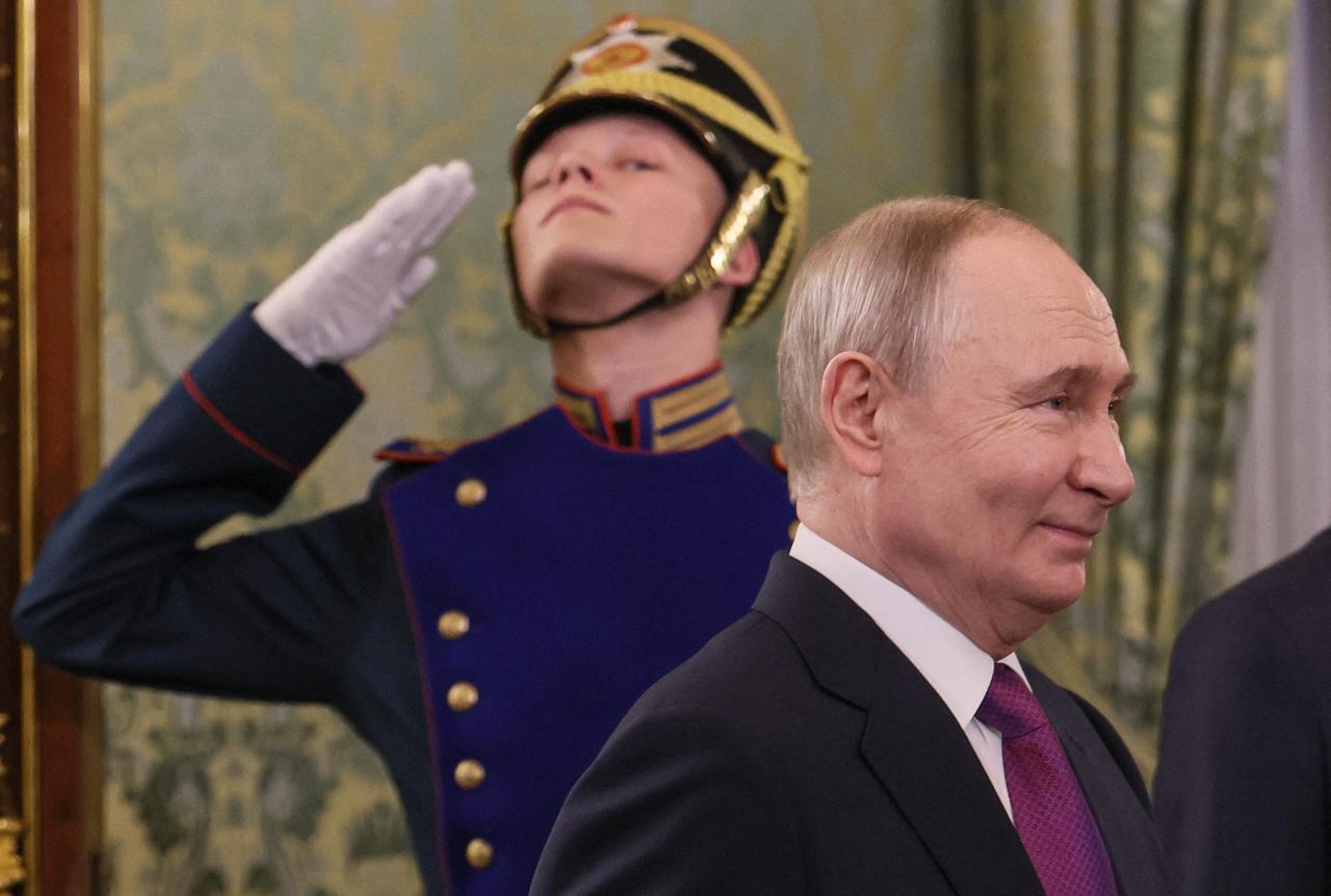 Russian President Vladimir Putin enters a hall for a meeting with Syria's President at the Kremlin in Moscow on January 28, 2026. (AFP Photo)